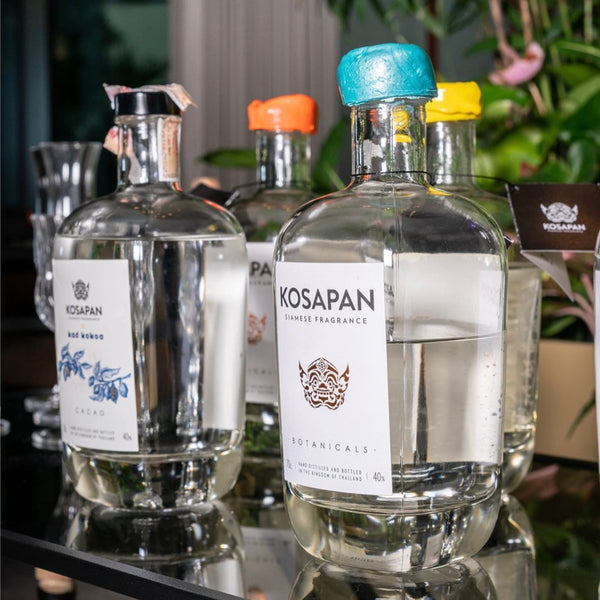 Bottles of Kosapan spirits with Botanicals Ori-Gin in foreground