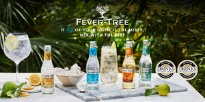 Fever-Tree bottles served on a white marble tray on table in a garden with limes, oranges and iced glasses with logos of Drinks International Awards