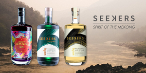 3 bottles of Seekers Gin variations with the Mekong river along the forest in the background