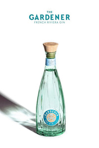 Image of The Gardener Gin bottle: A sleek transparent green artistic 700ml bottle with a premium blend of juniper, coriander, and angelica.